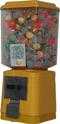 mquina amarilla con  bolas de capsulas